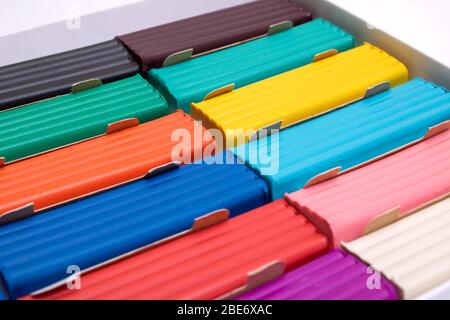 Multi-colored plasticine in a box close-up, background Stock Photo
