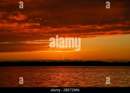 Brilliant Awe-Inspiring Sunset over the St. Johns River in Vilano Beach, Florida Stock Photo