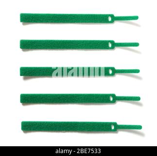 green velcro cable ties on white background Stock Photo