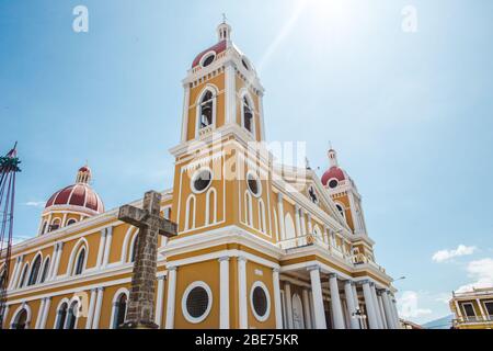 Iglesia Catedral Inmaculada Concepción de María: the famous yellow cathedral in the main square of Granada, Nicaragua Stock Photo