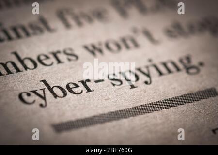 Close up shot of a cyber spying text written newspaper. Stock Photo