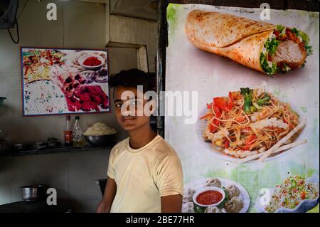 Portrait of a young man at his food stall, Kolkata, India Stock Photo