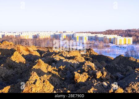 large piles of soil excavated from pits which is stored for use in vertical planning and landscaping Stock Photo