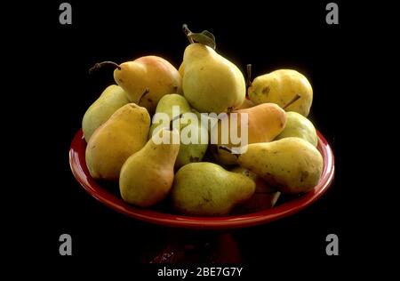 Bartlett pears in a red bowl still-life Stock Photo