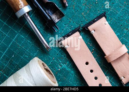 Genuine pink vegetable tanned leather making watch strap crafts working Stock Photo
