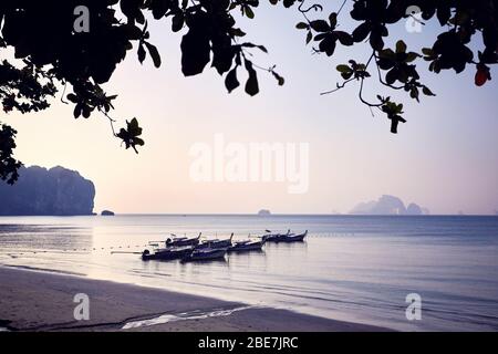 Traditional long tail on the tropical beach at morning in Andaman Sea, Thailand Stock Photo