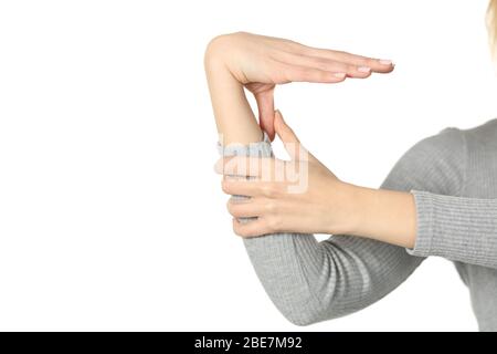 Close up of hypermobile woman hand bending thumb and wrist isolated on white background Stock Photo