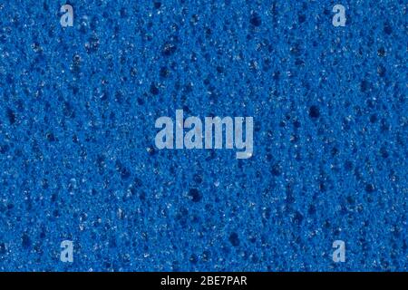 Saturated blue ethylene vinyl acetate EVA texture with contrast uneven surface. Stock Photo