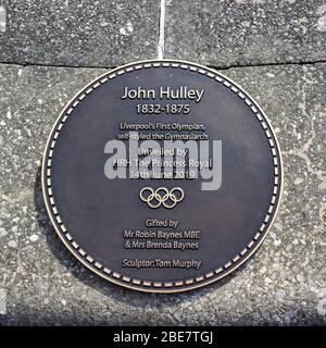 Plaque next to John Hulley sculpture, Liverpool's first Olympian, Kings Parade, Liverpool Stock Photo