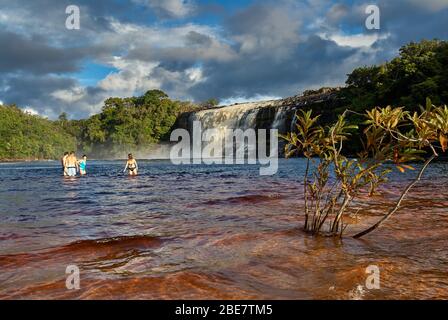 tourists in front of El Sapo Waterfalls, Canaima NATIONAL PARK, Venezuela, South America, America Stock Photo