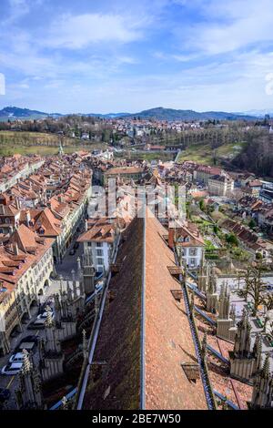 View from Bern Cathedral to the red tiled roofs of the houses in the historic centre of the old town, city view with surrounding countryside, Inner Stock Photo