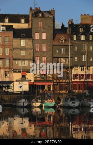 Honfleur, France - December 30, 2016 : Morning light on building at Honfleur port is a truly picturesque and one of charming harbour in France Stock Photo