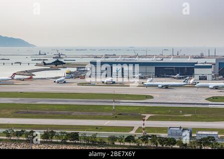 Lantau, Hong Kong  - April 10, 2020 :  Inside view of airport at runway, all parking space is fully occupied because of travel alert Stock Photo
