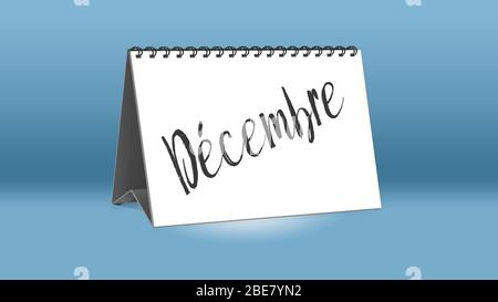 A calendar for the desk shows the French month of Decembre (December in English language) Stock Photo