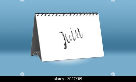 A calendar for the desk shows the French month of Juin (June in English language) Stock Photo