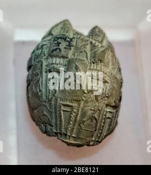 Egypt, Cairo, Egyptian Museum, clay seal with impression coming from a cylinder seal. This mud seal was found in Umm el Qab, Abydos. Dynasty 1. Stock Photo