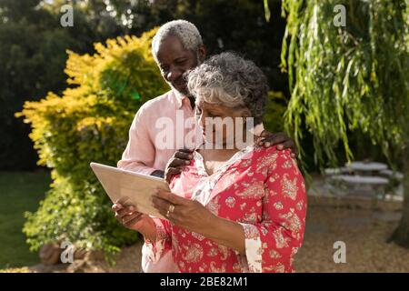An African American couple spending time together in the garden Stock Photo