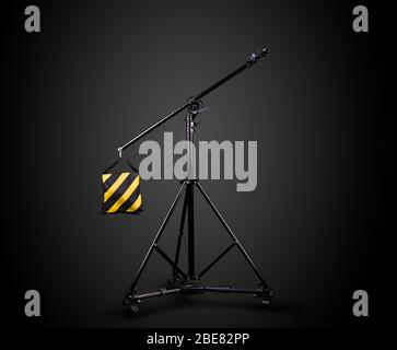 Photo studio lighting stands isolated on the black background. Stock Photo