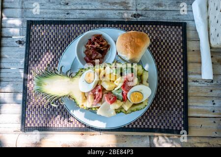 Traditional Tropical Thai salad, its serving  on pineapple with egg and some vegetables Stock Photo