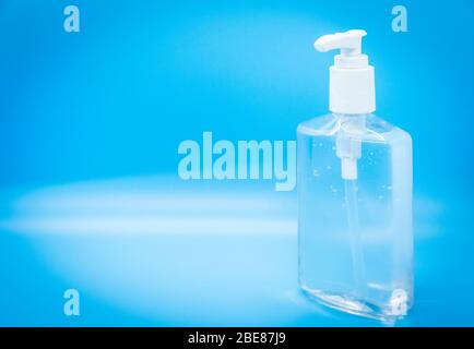 Clear hand sanitizer jel isolated on a blue background. Stock Photo