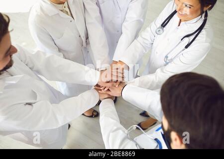 Group of doctors joined hands together. Medicine healthcare clinic hospital concept . Stock Photo