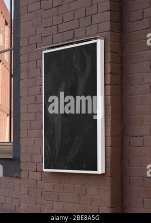 Blank black glass rectangular poster mock up brick wall mounted Stock Photo