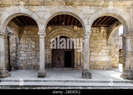Entrance door and main facade of ancient church in San Martín del Castañar. Sierra de Bejar. Salamanca. Spain. UNESCO World Heritage site. Stock Photo