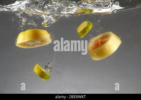 Photo of fresh sliced tomato and calamansi dropped in water Stock Photo