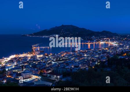 Aerial night view of Zakynthos Zante town. Beautiful cityscape panorama of Greece city. Traveling concept background. Stock Photo