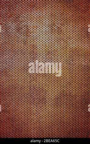 Industrial background of a rusty iron surface perforated with many holes Stock Photo