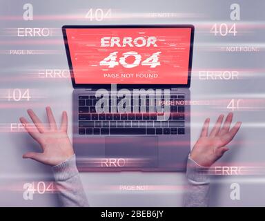 Displeased spread hands, 404 page not found on laptop screen Stock Photo
