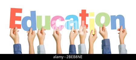 Multiple hands holding alphabets to form the word Education on white background, education or learning concept Stock Photo