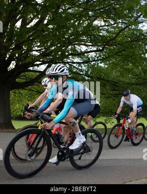 Cyclists caught in action whilst competing in a Criterium Race at Crystal Palace Park. Stock Photo