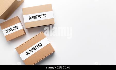 Set of cardboard boxes wait delivery, disinfected from coronavirus Stock Photo