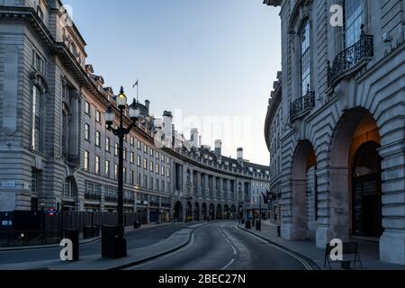 London under lockdown: The streets are eerily empty but the bright lights stay on in the normally bustling heart of the city. Stock Photo