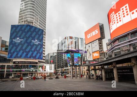 An empty Yonge-Dundas Square in downtown Toronto, Canada, March 17, 2020. Amid security measures directed at slowing the spread of the COVID-19 virus, the Province of Ontario declared a state of emergency March 17, 2020. The new regulations will largely restrict people going to restaurants and will close bars, gyms, churches, among others. Stock Photo