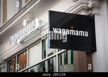 LONDON- Wagamama exterior logo, a popular British chain of asian restaurants based on Japanese food Stock Photo