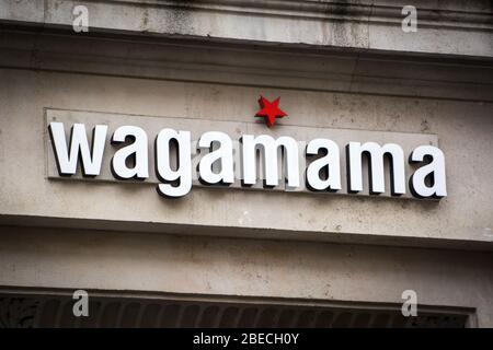 LONDON- Wagamama exterior logo, a popular British chain of asian restaurants based on Japanese food Stock Photo