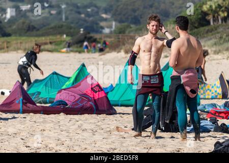 Tarifa, Spain. 3rd February, 2020.  Kitesurfers preparing to go to the water near the windy Bolonia beach Stock Photo