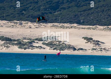 Tarifa, Spain. 3rd February, 2020.  Kitesurfer in the Atlantic ocean near the windy Bolonia beach Stock Photo