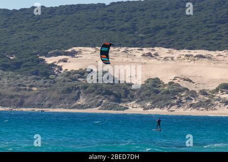 Tarifa, Spain. 3rd February, 2020.  Kitesurfer in the Atlantic ocean near the windy Bolonia beach Stock Photo