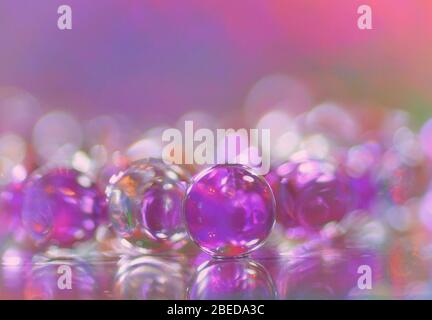 Awesome abstract photo of pink and white bubbles on a colorful multicolor bokeh background Stock Photo
