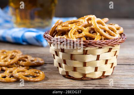 Party Snack - Salted Hard Pretzels on a wooden table. Stock Photo
