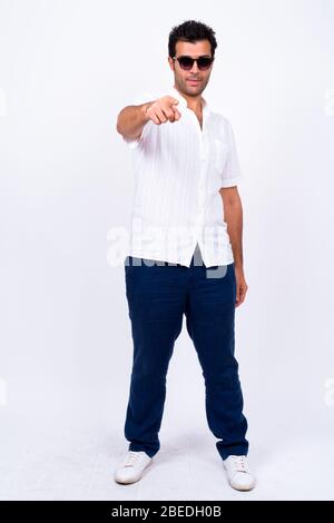 Full body shot of handsome Persian businessman in suit Stock Photo - Alamy