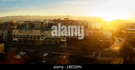 Row of buildings in an urban street at sunset. Stock Photo