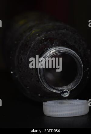 Last drop of the water is coming out of the bottle Stock Photo