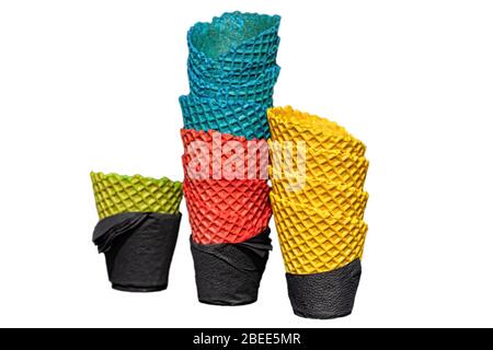 several colorful delicious ice cream waffle cups wrapped in black napkins, close-up, isolate Stock Photo