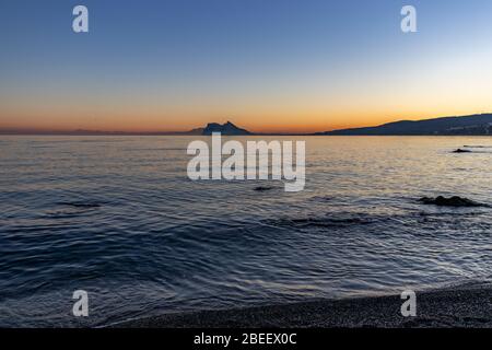 Rock of Gibraltar seen at sunset from Alcaidesa beach in Spain Stock Photo