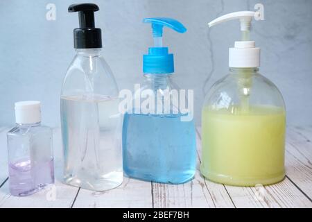 Close up of hand sanitizer and liquid soap on table Stock Photo