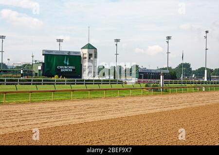 Churchill Downs Racetrack; dirt track, turf track, railings, signs, tall light stands, finish line, horse racing, home of Kentucky Derby; Louisville; Stock Photo